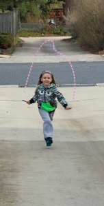 I love to jump rope now.  It is so much fun to walk and jump rope, jump rope backwards, sing songs and jump rope, and even jump rope and watch TV!  My Daddy bought me a pink, white, and black colored jump rope.  Isn't he the best?!