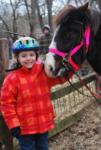I started learning how to ride ponies  at my Pony Club at Sandy Hill Farm.  I get to brush them, take dirt out of their little feet, and go on trail rides.  Now I'm learning how to trot with the pony.  I love it so much!!